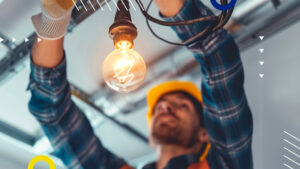 electrician repairing a light bulb